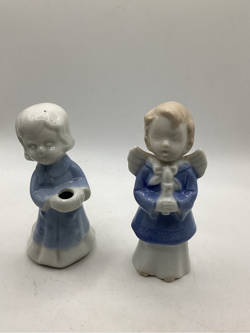 Porcelain Angel Figurine Pair in Blue and White. One holds candle.